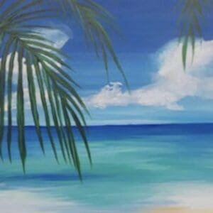 Tropical shoreline with overhanging palm fronds