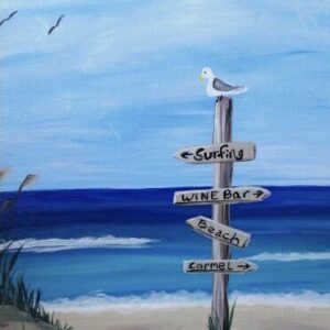 A painting of a seagull on a wooden sign at the beach.
