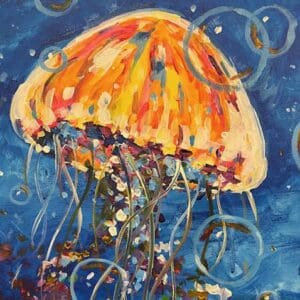 A colorful jellyfish with bubbles underwater.