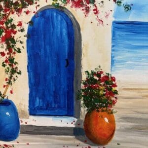 Blue arched door with potted flowers, seaside